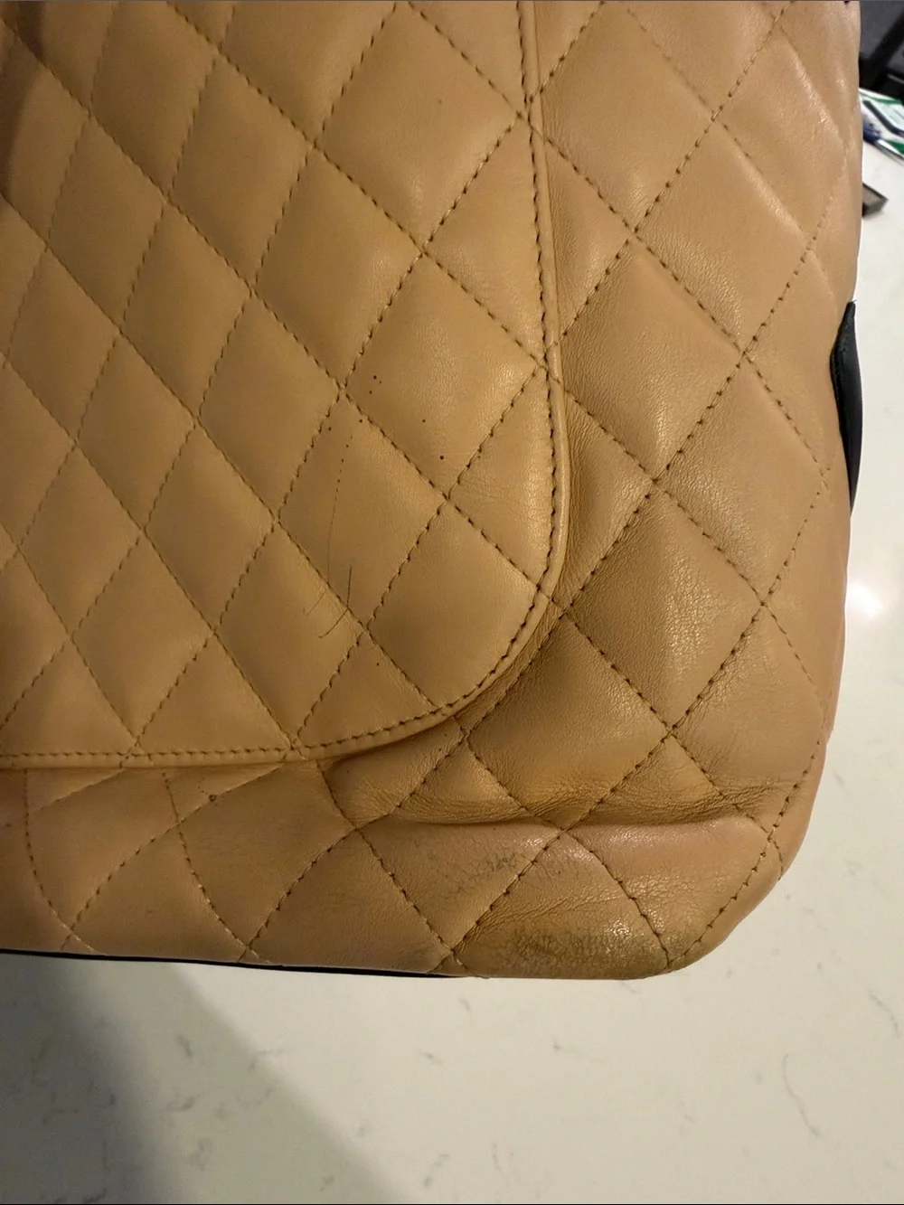 CHANEL Beige Quilted Tote with Black Accents